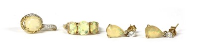 Lot 159 - A 9ct gold three stone opal ring