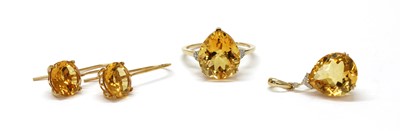 Lot 256 - A 9ct gold citrine and diamond ring