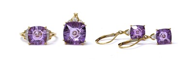 Lot 196 - A gold cushion shaped fantasy cut amethyst and diamond ring, pendant and earrings suite