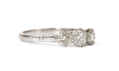 Lot 1198 - A platinum three stone diamond ring