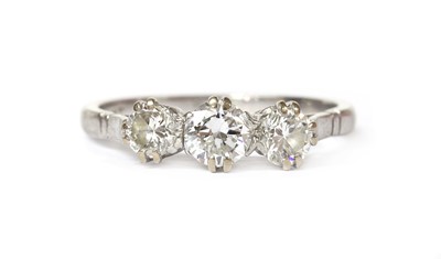 Lot 1198 - A platinum three stone diamond ring