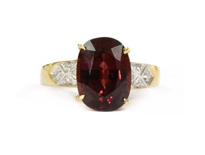 Lot 98 - A 9ct gold garnet and diamond ring, pendant and earrings suite