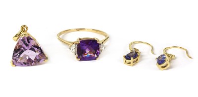 Lot 138 - A 9ct gold amethyst and zircon ring