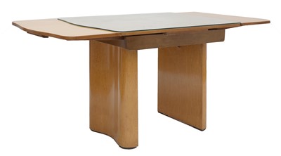 Lot 182 - An Art Deco bird's-eye maple extending dining table