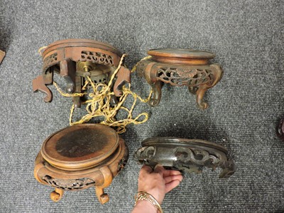 Lot 162 - A collection of Chinese wood stands