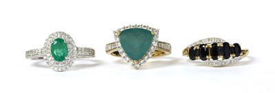 Lot 388 - A 9ct white gold emerald and zircon cluster ring