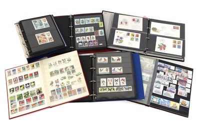 Lot 258 - A large quantity of stamps and postcards in approximately forty albums