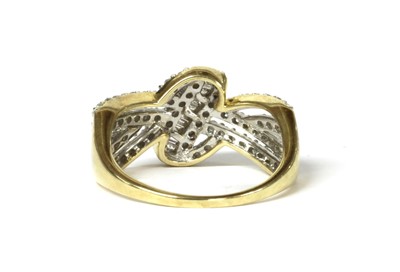 Lot 29 - A 9ct gold diamond set knot design ring