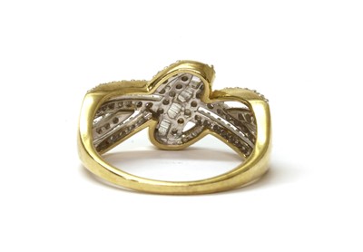 Lot 65 - A 9ct gold diamond set knot design ring
