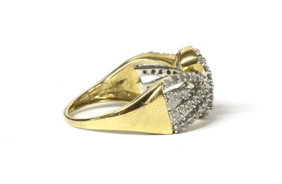 Lot 134 - A 9ct gold diamond set knot design ring
