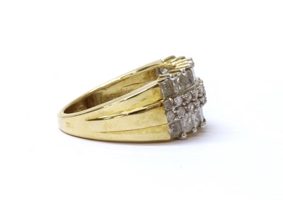 Lot 66 - A 9ct gold four row diamond ring
