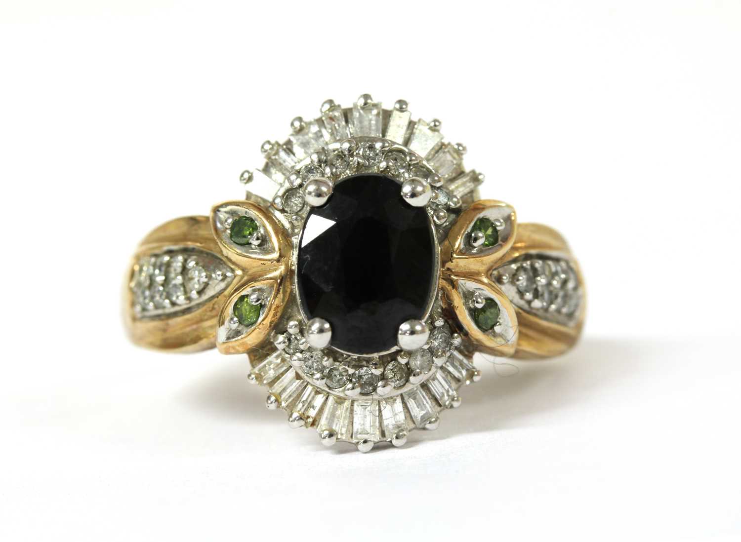 Lot 103 - A 9ct gold sapphire and diamond cluster ring