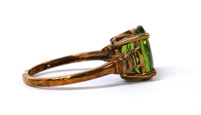 Lot 130 - A 9ct gold peridot and diamond ring