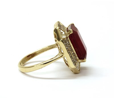 Lot 223 - A 9ct gold fracture filled ruby and zircon ring