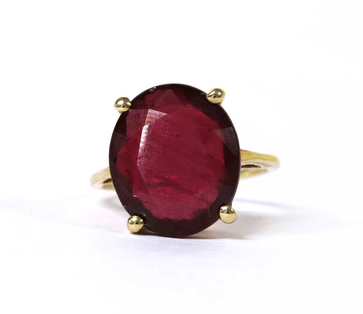 Lot 89 - A 9ct gold single stone fracture filled ruby ring