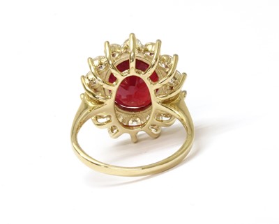 Lot 217 - A 9ct gold fracture filled ruby and zircon cluster ring