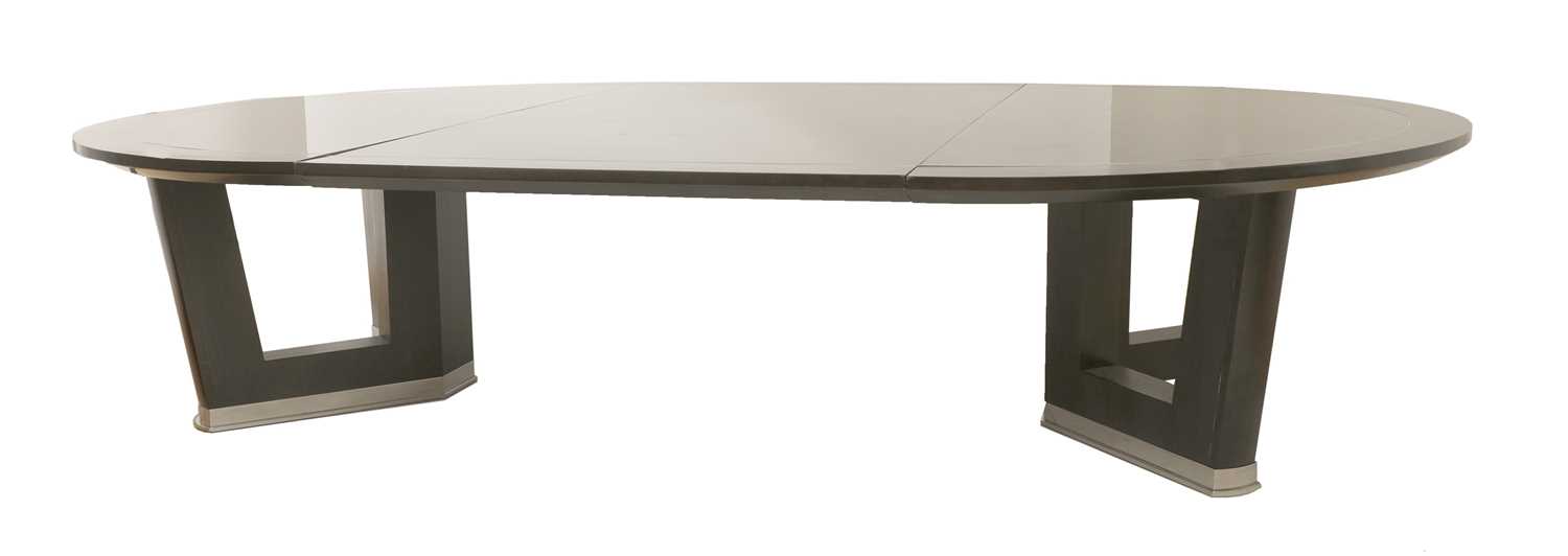 Lot 777 - A contemporary ebonised ash extending dining table