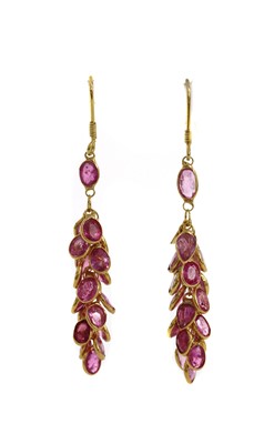 Lot 1227 - A pair of gold pink sapphire drop earrings