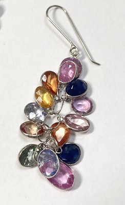Lot 1233 - A pair of white gold varicoloured sapphire drop earrings
