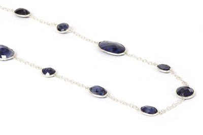 Lot 1292 - A silver sapphire long chain