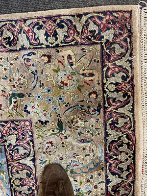 Lot 248 - A Persian silk carpet