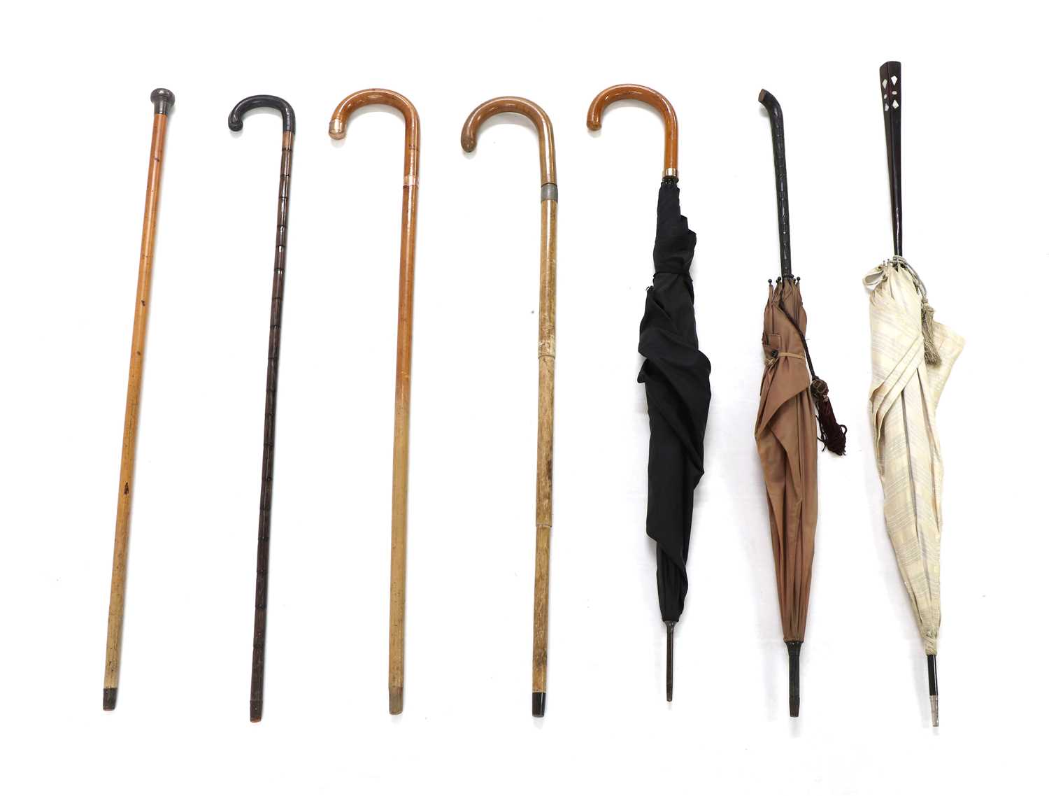 Lot 301 - A collection of vintage canes and umbrellas