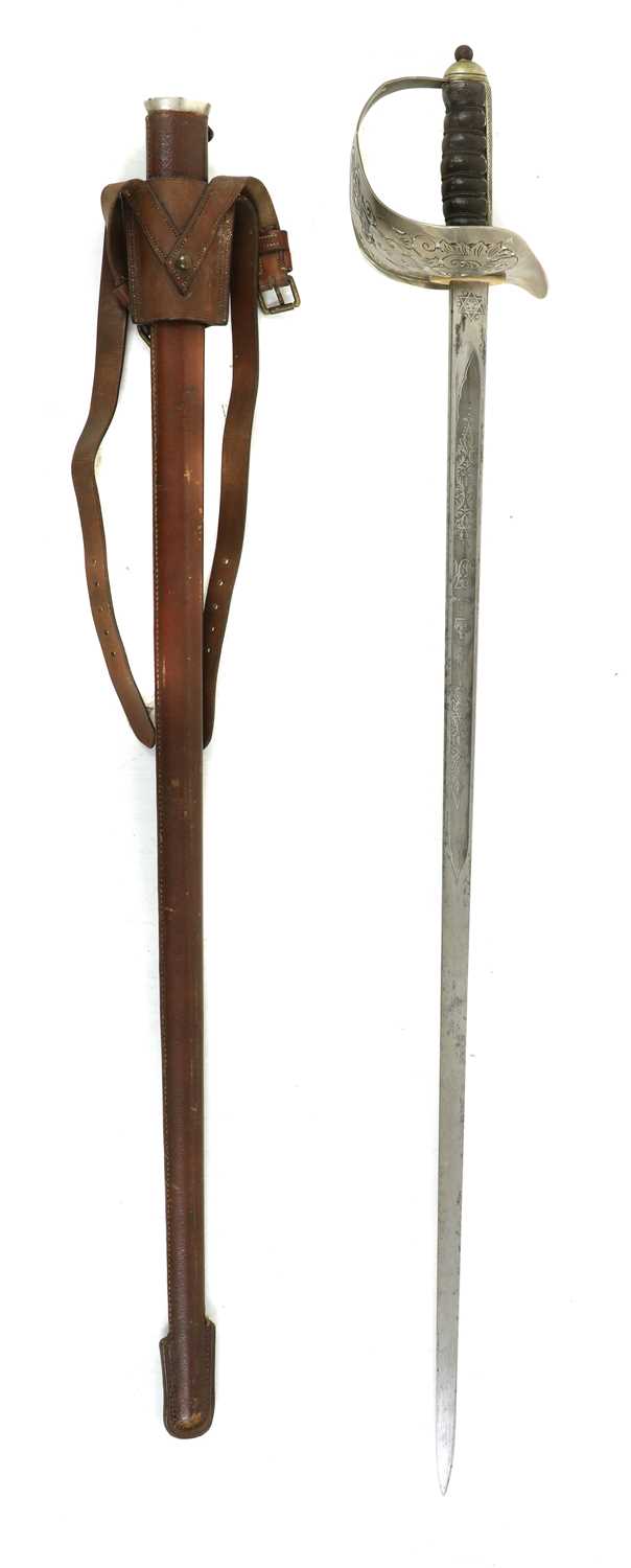 Lot 147 - An 1897 pattern officer’s dress sword in a leather scabbard