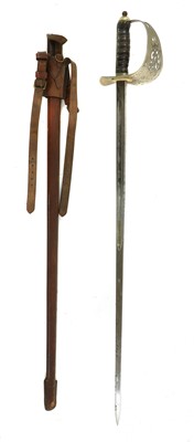 Lot 147 - An 1897 pattern officer’s dress sword in a leather scabbard