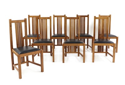Lot 375 - A set of eight oak dining chairs