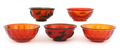 Lot 73 - A collection of three Chinese overlay Peking glass bowls