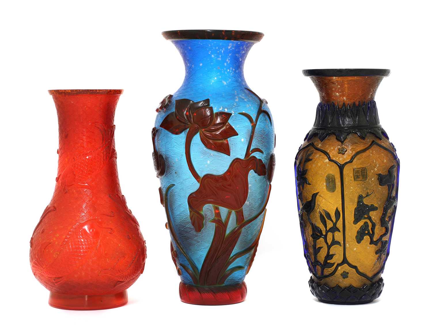 Lot 79 - Three Chinese overlay Peking glass vases