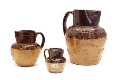 Lot 194 - Three two-tone stone jugs