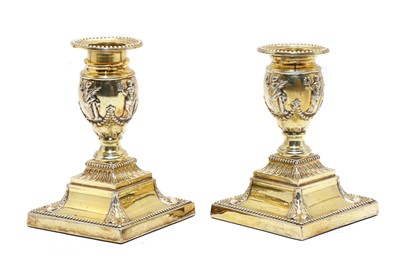 Lot 52 - A pair of silver-gilt dwarf candlesticks
