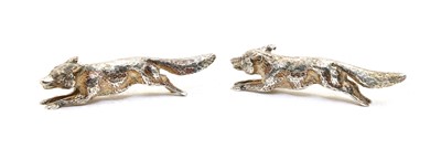 Lot 64 - Two silver running fox ornaments