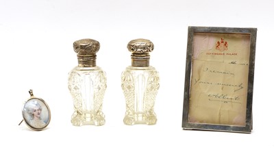 Lot 49 - Two silver mounted and glass scent bottles