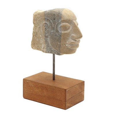 Lot 109 - A carved stone head