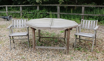 Lot 363 - An octagonal teak extending garden table