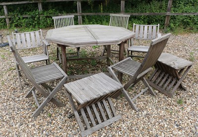Lot 363 - An octagonal teak extending garden table
