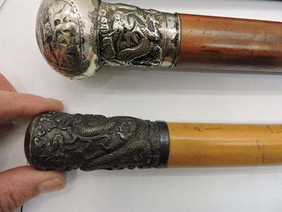 Lot 300 - A collection of Chinese silver and white-metal mounted walking sticks