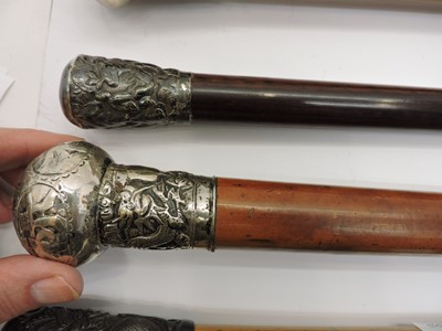 Lot 300 - A collection of Chinese silver and white-metal mounted walking sticks