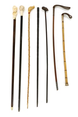 Lot 313 - A small collection of walking sticks and canes