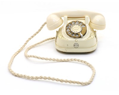 Lot 174 - A cream Bakelite telephone