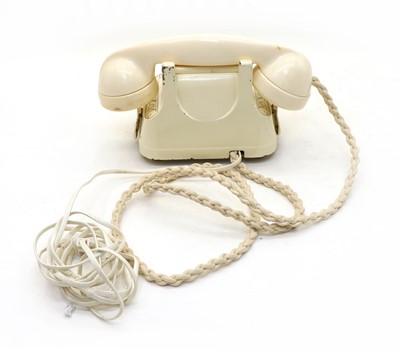 Lot 174 - A cream Bakelite telephone
