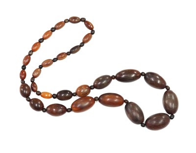 Lot 89 - A single row graduated olive shaped buffalo horn bead necklace