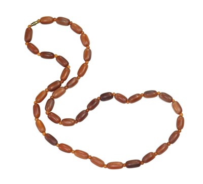 Lot 60 - A single row uniform barrel shaped buffalo horn bead necklace