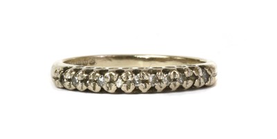 Lot 45 - An 18ct white gold diamond half eternity ring