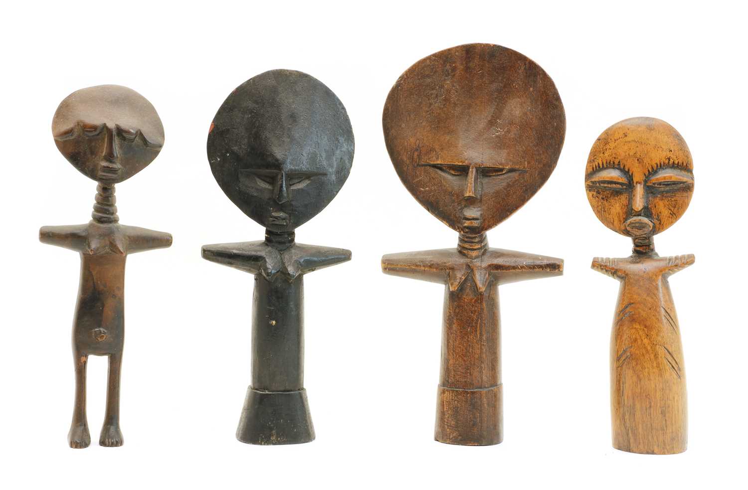 Lot 82 - Four Ashanti carved wooden disc head fertility dolls
