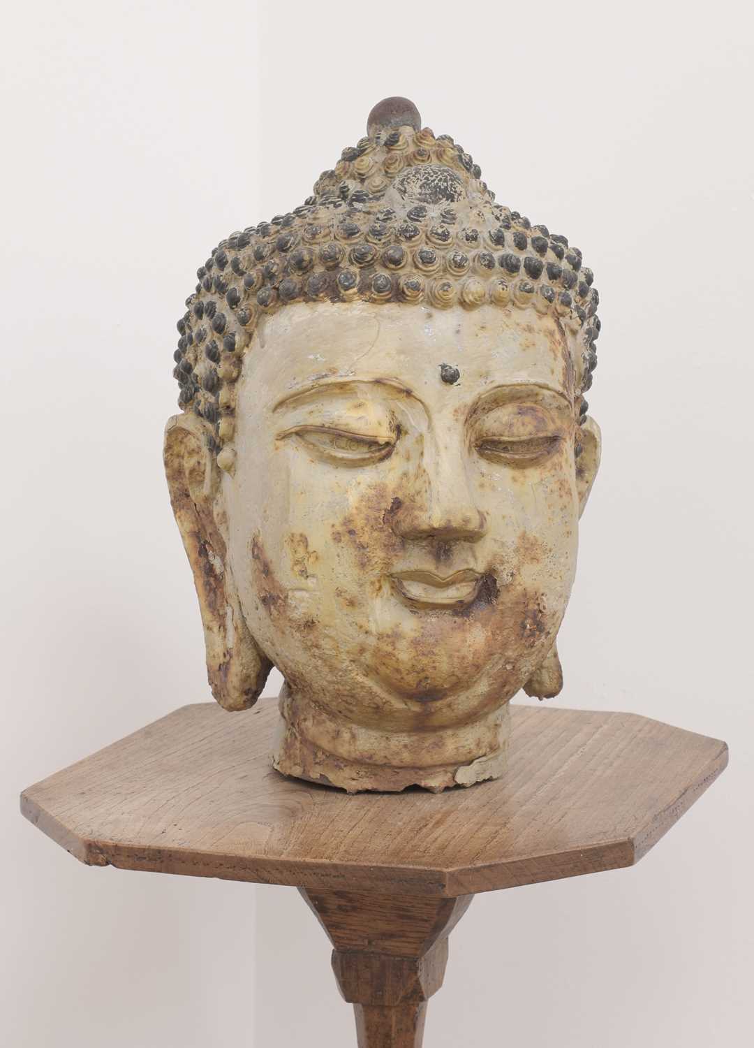 Lot 493 - A cast and painted metal head of Buddha