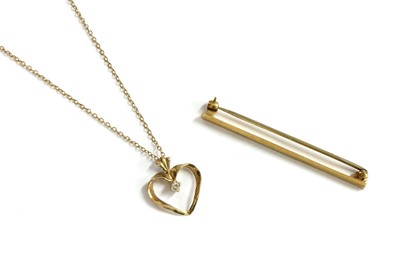 Lot 180 - A 9ct gold diamond set open heart pendant