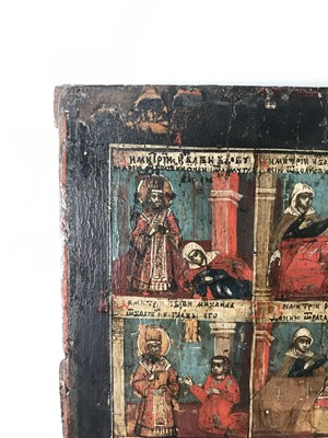 Lot 93 - An icon of three chosen saints with scenes from their lives